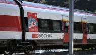 A train of Swiss Railways is seen on September 4, 2020, in Camorino, southern Switzerland, during the inauguration of the Ceneri Base railway tunnel.  / AFP / Fabrice COFFRINI
