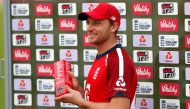 England's Jos Buttler poses with his man of the match award after England's victory in the international Twenty20 cricket match between England and Australia at the Ageas Bowl in Southampton, southern England on September 6, 2020.