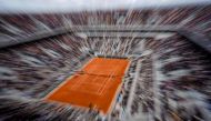 (FILES) In this file photo taken on June 7, 2019, Spain's Rafael Nadal returns the ball to Switzerland's Roger Federer during their men's singles semi-final match on day 13 of The Roland Garros 2019 French Open tennis tournament in Paris./ AFP / Kenzo TRI