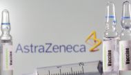 A test tube labelled with the Vaccine is seen in front of AstraZeneca logo in this illustration taken, September 9, 2020. REUTERS/Dado Ruvic