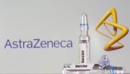 A test tube labelled with the Vaccine is seen in front of AstraZeneca logo in this illustration taken, September 9, 2020. REUTERS/Dado Ruvic/Illustration
