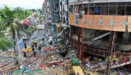 TOPSHOT - Firefighters work at the scene of an explosion in Zhuhai, in China's southern Guangdong province on September 11, 2020. At least three people were injured on September 11 when a gas pipe exploded in a store in the southern city of Zhuhai, local 