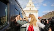 Women try to block a vehicle of law enforcement officers during a rally against police brutality following protests to reject the presidential election results in Minsk, Belarus September 12, 2020. Tut.By