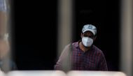 A commuter wearing a facemask as a preventive measure against the Covid-19 coronavirus walks out of a metro station in New Delhi on September 16, 2020. India's total coronavirus cases passed five million on September 16, health ministry data showed, as th
