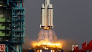 The Long March II-F rocket loaded with a Shenzhou-9 manned spacecraft carrying three Chinese astronauts lifts off from the launch pad in the Jiuquan Satellite Launch Center, Gansu province June 16, 2012. REUTERS/Jason Lee/File Photo