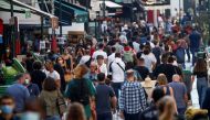 People wearing protective face masks walk in a busy street in Paris as France reinforces mask-wearing in public places as part of efforts to curb a resurgence of the coronavirus disease (COVID-19) across France, September 18, 2020. REUTERS/Gonzalo Fuentes