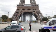 French police secure the area near the Eiffel Tower after the French tourism landmark was evacuated following a bomb alert in Paris, France, September 23, 2020. REUTERS/Charles Platiau