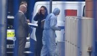 A forensic team is pictured at the Croydon Custody Centre in south london on September 25, 2020, following the shooting of a British police officer by a 23-year-old man being detained at the centre. A British police officer was shot dead in the early hour
