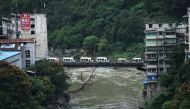 Ambulances wait outside the Songzao Coal Mine near Chongqing, in southwest China on September 27, 2020. Sixteen workers died and one is in a critical condition after being trapped underground in a coal mine in southwest China on September 27, reported sta