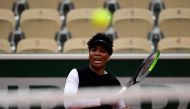 Venus Williams of the US reacts as she plays a return against Slovakia's Anna Karolina Schmiedlova during their women's singles first round tennis match at the Simonne Mathieu court on Day 1 of The Roland Garros 2020 French Open tennis tournament in Paris
