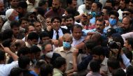 Shehbaz Sharif, brother of former Prime Minister Nawaz Sharif and leader of Pakistan Muslim League-Nawaz (PML-N), walks with lawyers and supporters after the High Court rejected bail plea in money laundering case in Lahore, Pakistan September 28, 2020. RE