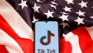 FILE PHOTO: TikTok's logo is displayed on the smartphone while standing on the U.S. flag in this illustration picture taken, November 8, 2019. REUTERS/Dado Ruvic/File Photo

