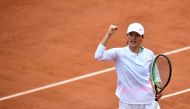 Poland's Iga Swiatek celebrates after winning a point against Canada's Eugenie Bouchard during their women's singles third round tennis match on Day 6 of The Roland Garros 2020 French Open tennis tournament in Paris on October 2, 2020. / AFP / Anne-Christ