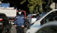 Police officers stand guard at a checkpoint during a partial lockdown amid the coronavirus disease (COVID-19) outbreak in Madrid, Spain, October 3, 2020. REUTERS/Javier Barbancho
