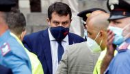 Far-right leader Matteo Salvini stands next to his lawyer, Giulia Bongiorno while she is assisted by medical personnel outside the court in Catania, Italy, October 3, 2020. REUTERS/Antonio Parrinello