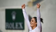 Italy's Martina Trevisan celebrates after winning against Netherlands' Kiki Bertens during their women's singles fourth round tennis match on Day 8 of The Roland Garros 2020 French Open tennis tournament in Paris on October 4, 2020. / AFP / Anne-Christine