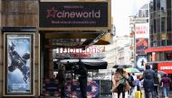 People walk past a Cineworld in Leicester's Square, amid the coronavirus disease (COVID-19) outbreak in London, Britain, October 4, 2020. REUTERS/Henry Nicholls
