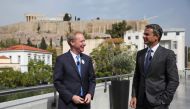 President of Microsoft Brad Smith speaks with Greek Prime Minister Kyriakos Mitsotakis, with the ancient Acropolis hill in the background, during an event on the company's new investment in Greece, at the Acropolis Museum in Athens, Greece October 5, 2020