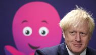 Britain's Prime Minister Boris Johnson visits the headquarters of Octopus Energy on October 5, 2020 in London. The visit coincides with the company's plan to create 1,000 new technology jobs across sites in England. / AFP / POOL / Leon Neal