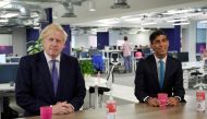 Britain's Prime Minister Boris Johnson and Britain's Chancellor of the Exchequer Rishi Sunak visit the headquarters of Octopus Energy, in London, Britain October 5, 2020. Leon Neal/Pool via Reuters 