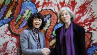 French microbiologist Emmanuelle Charpentier (L) and professor Jennifer Doudna of the U.S. pose for the media during a visit to a painting exhibition by children about the genome, at the San Francisco park in Oviedo, SPAIN, October 21, 2015. REUTERS/Eloy 