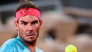 Spain's Rafael Nadal eyes the ball as he plays against Italy's Jannik Sinner during their men's singles quarter-final tennis match on Day 10 of The Roland Garros 2020 French Open tennis tournament in Paris on October 6, 2020. AFP / MARTIN BUREAU