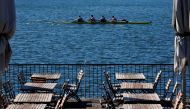 A boat passes an empty terrace of a restaurant on Alte Donau, an abandoned meander of river Danube, amid the coronavirus disease (COVID-19) outbreak in Vienna, Austria October 4, 2020. REUTERS/Leonhard Foeger
