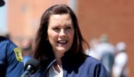 FILE PHOTO: Michigan Governor Gretchen Whitmer addresses the media about the flooding along the Tittabawassee River, after several dams breached, in downtown Midland, Michigan, U.S., May 20, 2020. REUTERS/Rebecca Cook/File Photo
