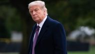  In this file photo taken on October 1, 2020 US President Donald Trump walks from Marine One after arriving on the South Lawn of the White House in Washington, DC, following campaign events in New Jersey. President Donald Trump should be able to resume 