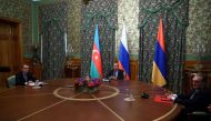This handout photograph released by the Russian Foreign Ministry shows Russian Foreign Minister Sergei Lavrov (C) as he chairs a meeting of Armenia's Foreign Minister Zohrab Mnatsakanyan (R) and Azerbaijan's Foreign Minister Jeyhun Bayramov in Moscow on O