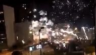 This handout image grab made from a video posted on the Twitter account of @LeCapricieux94 shows fireworks exploding outside the police station of Champigny-sur-Marne, outside Paris, in the night of October 10 to 11, 2020, as it is attacked by around 40 p