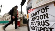 FILE PHOTO/Newspaper headline on display at Oxford Circus in London as the spread of the coronavirus disease (COVID-19) continues, in London, Britain, March 18, 2020. REUTERS/John Sibley
