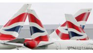 FILE PHOTO: British Airways aircraft are seen stationary on the tarmac of London's Heathrow Airport in west London, August 12, 2005. REUTERS/Toby Melville/File Photo
