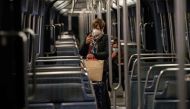People commute in a metro train, on October 17, 2020 in Paris, at the start of a nighttime curfew implemented to fight the spread of the Covid-19 pandemic caused by the novel coronavirus. AFP / ABDULMONAM EASSA