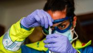 Madrid Emergency Service (SUMMA) UVI-8 unit's nurse Elena Tena holds a swab sample taken from a patient amid the coronavirus disease (COVID-19) outbreak in Madrid, Spain, October 19, 2020. Picture taken October 19, 2020. REUTERS/Juan Medina