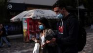 People wearing protective face masks make their way in Monastiraki square, amid the spread of the coronavirus disease (COVID-19), in Athens, Greece, October 22, 2020. REUTERS/Louiza Vradi 