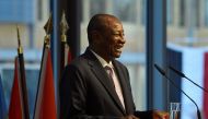 FILE PHOTO: Guinea's President Alpha Conde laughs as he addresses a conference in Berlin, Germany November 19, 2019. John MacDougall/Pool via REUTERS