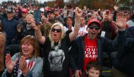 Supporters cheer as U.S. President Donald Trump delivers remarks during a campaign event at the Pickaway Agriculture and Event Center in Circleville, Ohio, U.S., October 24, 2020. REUTERS/Tom Brenner
