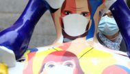 A woman takes a look of a sculpture of a 