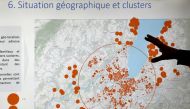 A County of Geneva staff member shows the geographical spread of clusters during an update briefing in the contact tracing unit, as Switzerland enters a second wave of coronavirus disease (COVID-19) outbreak, in Geneva, Switzerland, October 29, 2020. REUT