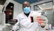 Laboratory technician Abdilelah Elnour Omer works inside the Medipark Diagnostics Lab that runs tests for the coronavirus disease (COVID-19), in Mogadishu, Somalia October 13, 2020. Picture taken October 13, 2020. REUTERS/Feisal Omar