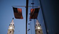 PHILADELPHIA, PENNSYLVANIA - NOVEMBER 04: The American flag hangs from a building near Philadelphia City Hall on November 04, 2020 in Philadelphia, Pennsylvania. Spencer Platt/Getty Images/AFP