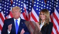 TOPSHOT - US President Donald Trump claps alongside US First Lady Melania Trump after speaking during election night in the East Room of the White House in Washington, DC, early on November 4, 2020. / AFP / MANDEL NGAN
