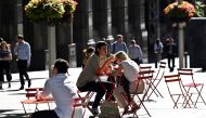 People spend their lunch hour in the central business district of Sydney on November 3, 2020. AFP / Saeed Khan 