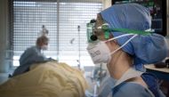 File photo of medical workers tend to patients. 