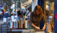 Jessica Graham, owner of independent book shop Primrose Hill Books, poses for a photograph in west London on November 6, 2020. [AFP/ Hollie Adams] 