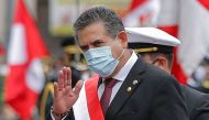 (FILES) In this file picture taken on November 10, 2020 the head of the Peruvian Congress, Manuel Merino, waves after being sworn in as interim President in Lima, day after the Congress voted to impeach and oust President Martin Vizcarra over corruption a