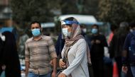 FILE PHOTO: An Iranian woman wears a mask and face shield, amid a rise in the coronavirus disease (COVID-19) infections, in Tehran, Iran October 24, 2020. Picture taken October 24, 2020. Majid Asgaripour/WANA (West Asia News Agency) via REUTERS 
