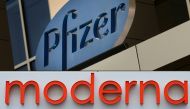 (COMBO) This combination of file pictures created on August 05, 2020 shows a sign for Pfizer pharmaceutical company in Cambridge, Massachusetts, on March 18, 2017, and the Moderna headquarters in Cambridge, Massachusetts on May 18, 2020. Pfizer, Moderna, 