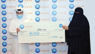 Sara Al Malki receiving the QR1m grand prize in Doha recently.  